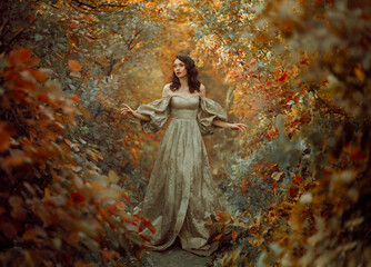 Wall Mural - Queen fantasy woman walks in path mystical autumn forest. Orange Gold red foliage fairy tale scenery trees. Happy smiling Princess girl. Vintage long golden dress, puffy sleeves. Sexy medieval lady.