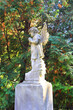 Antique angel sculpture over the headstone of an old grave in Baikove Cemetery in Kyiv, Ukraine