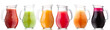 Smoothies of freshly pressed juices in glass pitchers, isolated