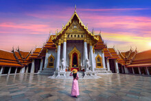 Tourists Walking At Wat Benchamabophit Or The Marble Temple In Bangkok, Thailand.