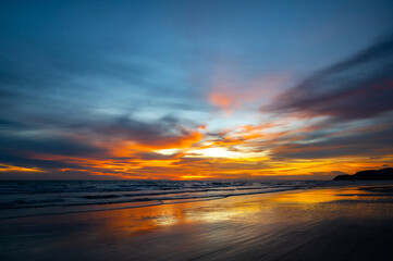 Wall Mural - colorful sunset on the beach.beautiful sunset over the sea.dramatic sky on twilight time and reflect