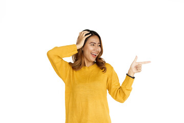 Sticker - Attractive positive young asian brunette woman in yellow sweater on white background, shocked or surprise