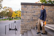 © zinkevych - Smiling adolescent boy walking down the steps