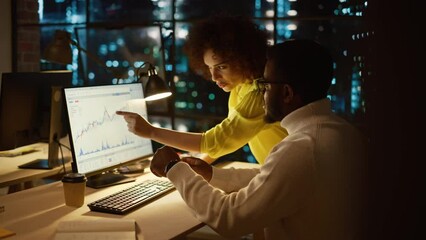 Aufkleber - Team of Two Young Entrepreneurs Talking, Discussing Growth Strategy at a Desk with Computer. Stylish Businesspeople Work on an Investment and Marketing Report in a Creative Agency in the Evening.
