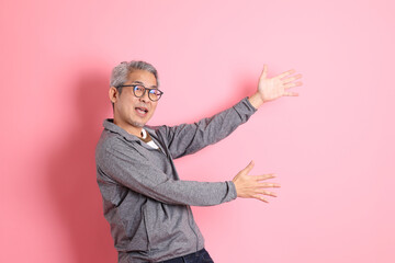 Wall Mural - Asian Man on Pink