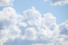 White Large Cumulus Clouds In The Blue Sky.