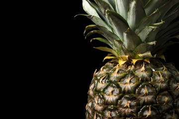 Poster - Pineapple on a black background. Tropical Fruit