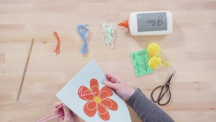 Wall Mural - Flat lay. Little girl learning how to sew with her mother at the craft table.