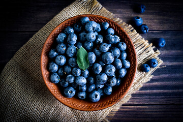 Wall Mural - Fresh blueberries on old background