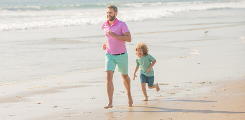 active family of daddy man and child boy running on beach together, togetherness