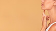 Facial treatment concept. Profile shot of beautiful woman with perfect skin touching her chin, panorama with copy space