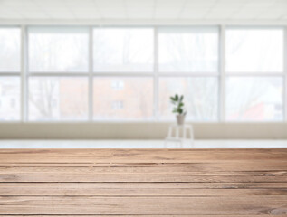 Wooden table in empty interior of room