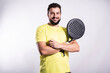 © FotoAndalucia - Man plays paddle tennis and poses in studio photos on white color background