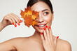 © Oleg Gekman - Portrait of beautiful young woman with autumn maple leafs. Healthy clean fresh skin natural make up beauty eyes and red nails
