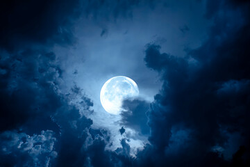 night sky with full moon. dramatic clouds in mystic moonlight. large bright moon as concept of myste
