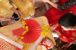 © DragonImages - Family Working on Wall Decoration for Tet