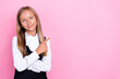 © deagreez - Photo of pretty lovely cute girl arm direct empty space advert banner promo dressed stylish trendy outfit isolated on pink color background