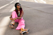 © JustLife - Urban woman enjoy outside. Modern woman posing with roller skates..