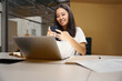 © Viacheslav Yakobchuk - Young business analyst with mobile phone is working online in conference room
