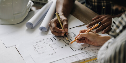 Wall Mural - Team construction engineers working at construction site with blueprint on table