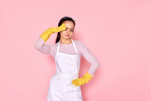 Tired Woman In Gloves And Cleaner Apron