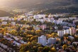 Fall in Banska Bystrica. City landscape with forests and mountains around. Autumn colored and at sunset.