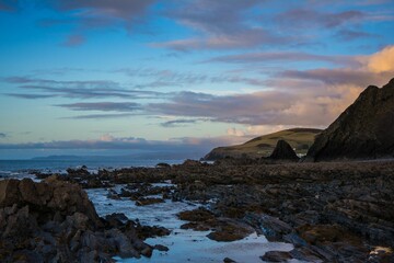 Canvas Print - Beautiful pink soft sunset over the coastline