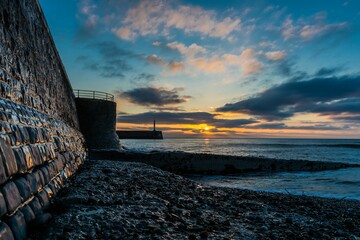 Canvas Print - Beautiful pink soft sunset over the coastline