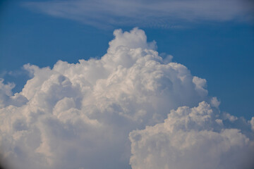 Wall Mural - white fluffy clouds in the blue sky background