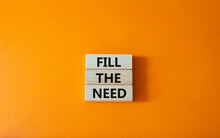 Fill The Need Symbol. Concept Word Fill The Need On Wooden Blocks. Beautiful Orange Background. Business And Fill The Need Concept. Copy Space