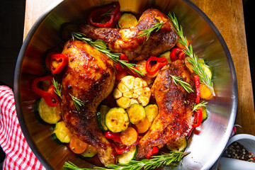 Wall Mural - Fried chicken legs with various vegetables and spices