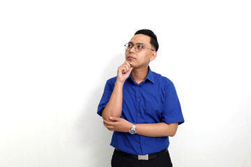 Thoughtful Young Asian employee standing against white background with copyspace