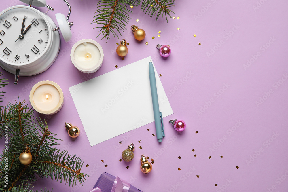 Composition with blank card, Christmas balls and burning candles on color background