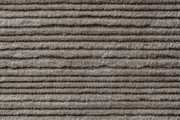 Wall Mural - Texture backdrop of beige colored corduroy fabric cloth. Corduroy retro fabric background or texture. Closeup view