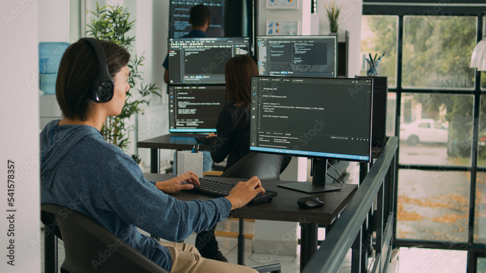 Junior developer programming code on terminal window, typing server ...