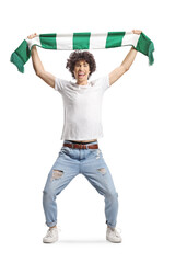 Sticker - Happy young man cheering with a green and white scarf