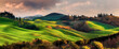 Beautiful and miraculous colors of green spring panorama landscape of Tuscany, Italy. Tuscany landscape with grain fields, cypress trees and houses on the hills at sunset.