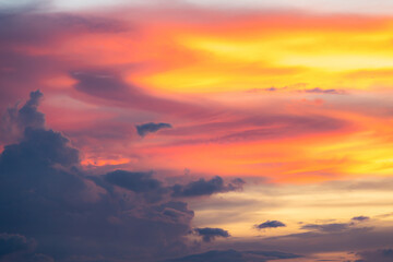 Wall Mural - The dramatic colors of the sunset in the sky gradient from blue to orange.