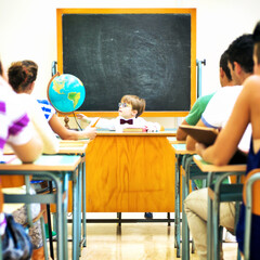 Little teacher in his classroom