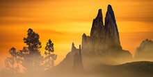 Digital Composite Of Misty Rock And Mountain Landscape With Pine Trees At Sunset