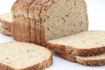 Close-up sliced ​​wholemeal bread, on white background
