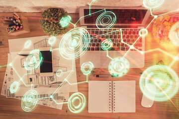 Poster - Social network hologram drawings over computer on the desktop background. Top view. Double exposure.