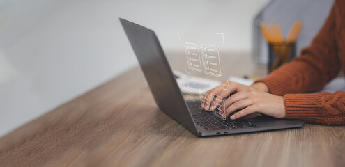 Businessman signs an electronic document on a digital document on a virtual laptop computer screen,Paperless workplace idea, e-signing, electronic signature, document management.	