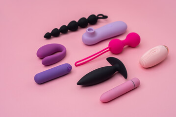 Variety of sex toys on a pink background