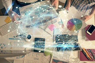 Aufkleber - Double exposure of man and woman working together and social network theme hologram drawing. Computer background. connecting concept. Top View.