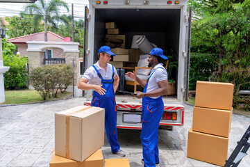 Professional goods move service use truck carry personal belongings door to door transport delivery handover boxes luggage one by one and keep stack on the floor before transfer to place in house