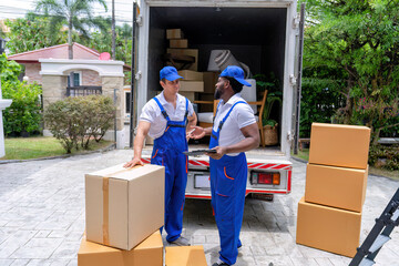 Professional goods move service use truck carry personal belongings door to door transport delivery handover boxes luggage one by one and keep stack on the floor before transfer to place in house