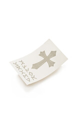 Close-up shot of a sheet of temporary cross tattoo. The sheet of water-based temporary tattoo is isolated on a white background. Top view.