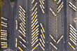 Herringbone pattern made of various buses and coaches standing at a bus depot. Transportation and communication concept. Aerial bird's eye perspective. High quality photo