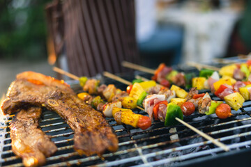 Wall Mural - Cute Asian woman grilling for a group of friends.